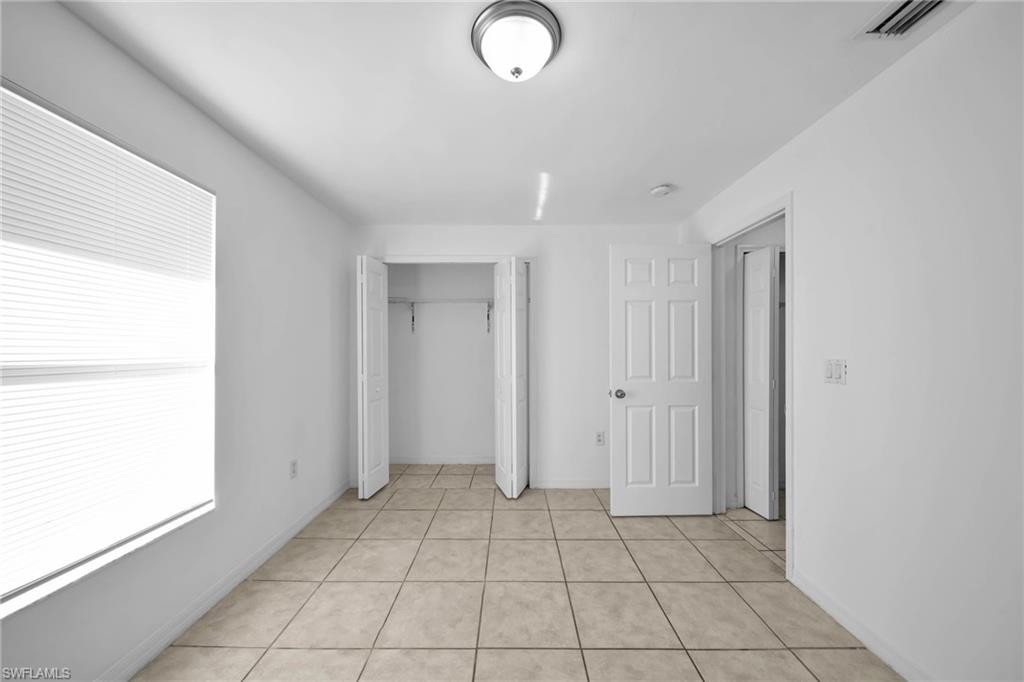 Neutral-toned tile flooring throughout