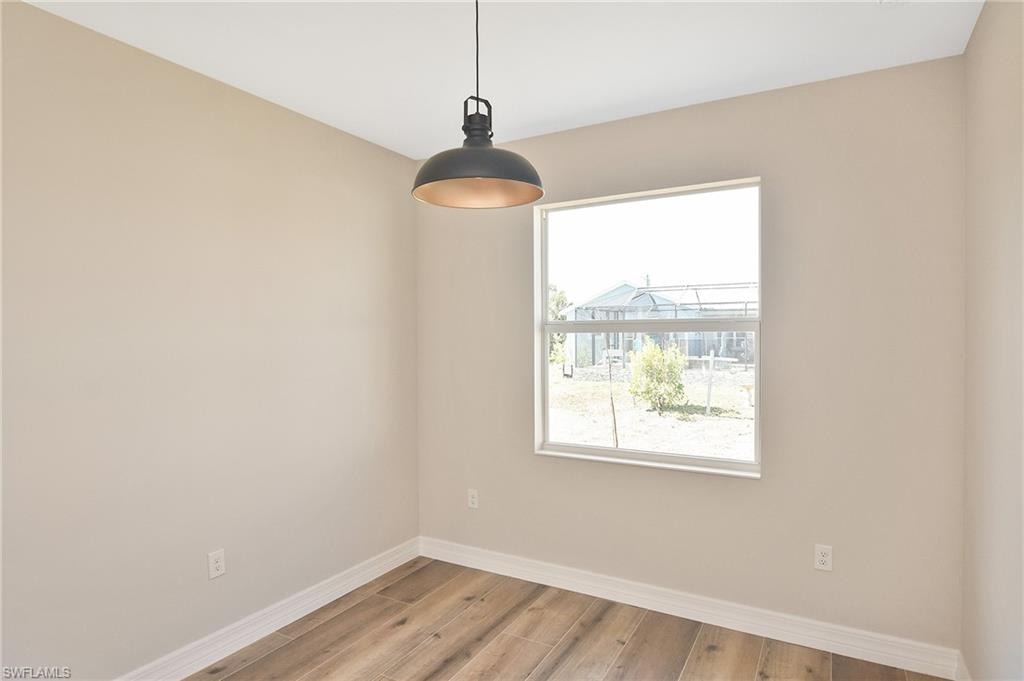 Neutral-toned walls complementing wood-finish flooring
