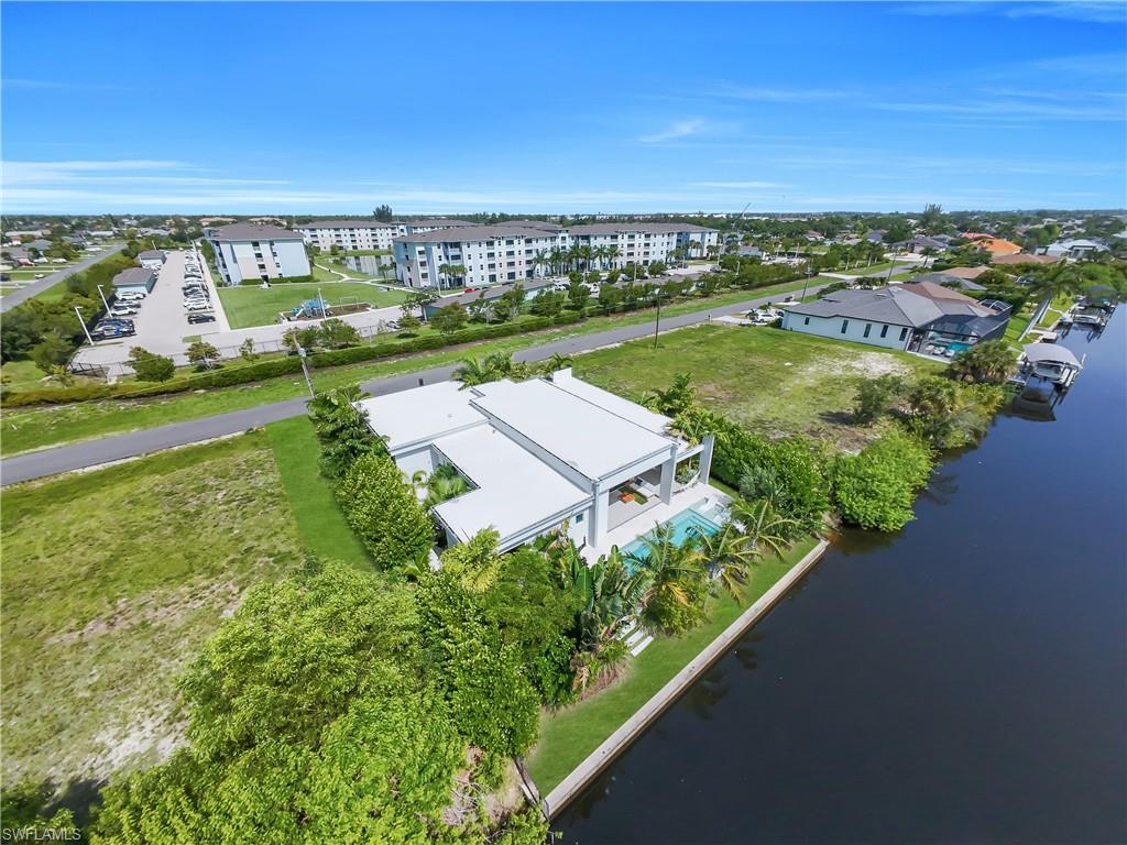 Modern waterfront residence featuring a private pool and a dedicated boat dock