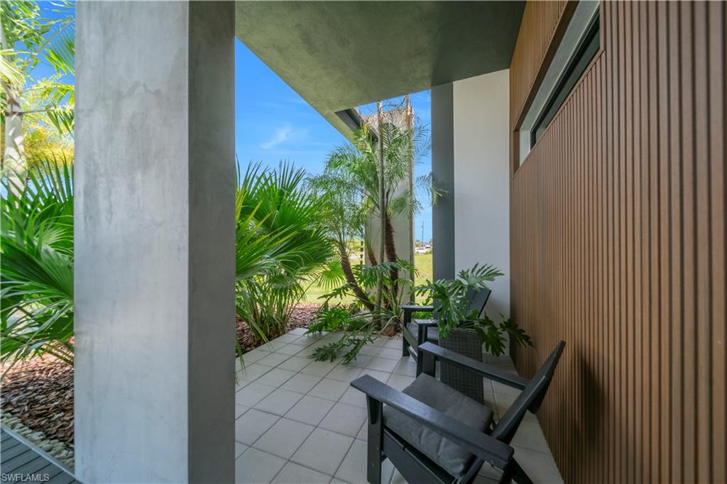 Private outdoor patio featuring light-toned square tile flooring