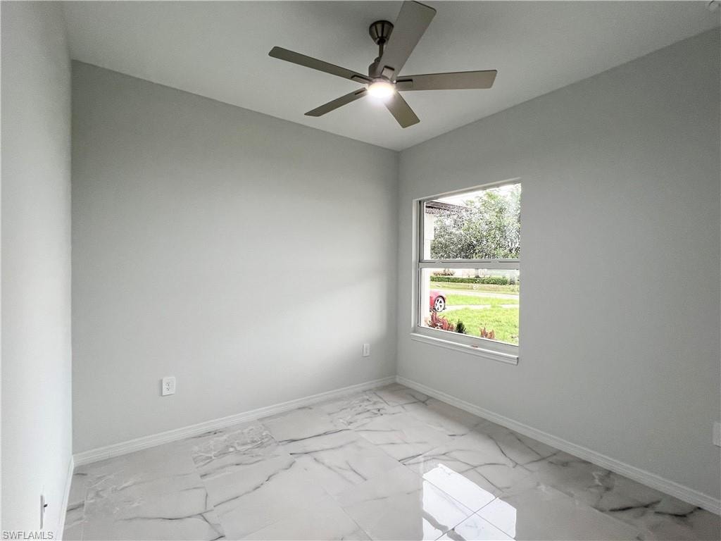 Bright interior space featuring large format marble-look tile flooring