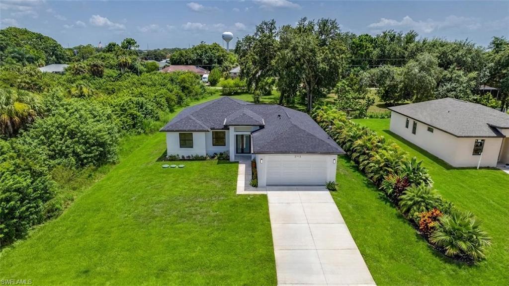Nice large yard, front & back! (Virtually enhanced)