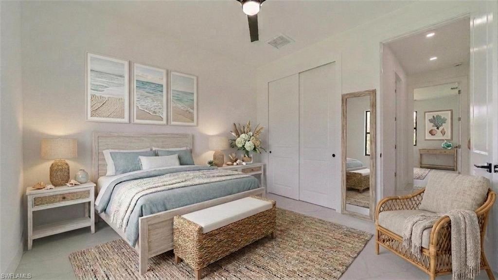 Front guest Bedroom, Hallway behind chair leads to guest/second bathroom & another guest bedroom. (Virtually staged)