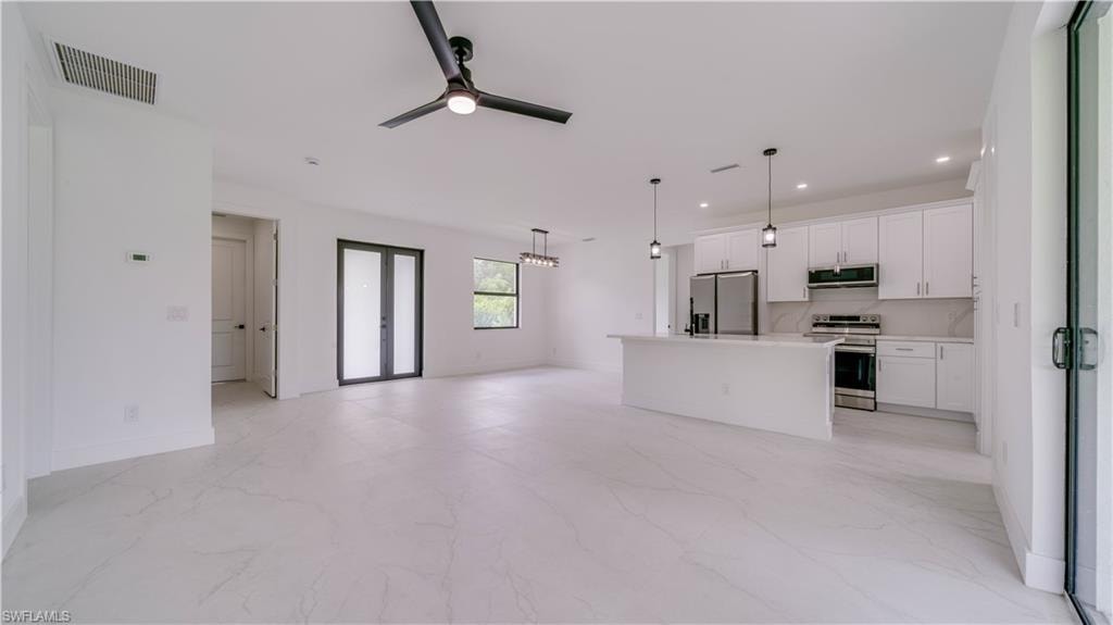 Double front door entry! Gorgeous tile flooring throughout! High 9'4" ceilings, & 8' tall doors!