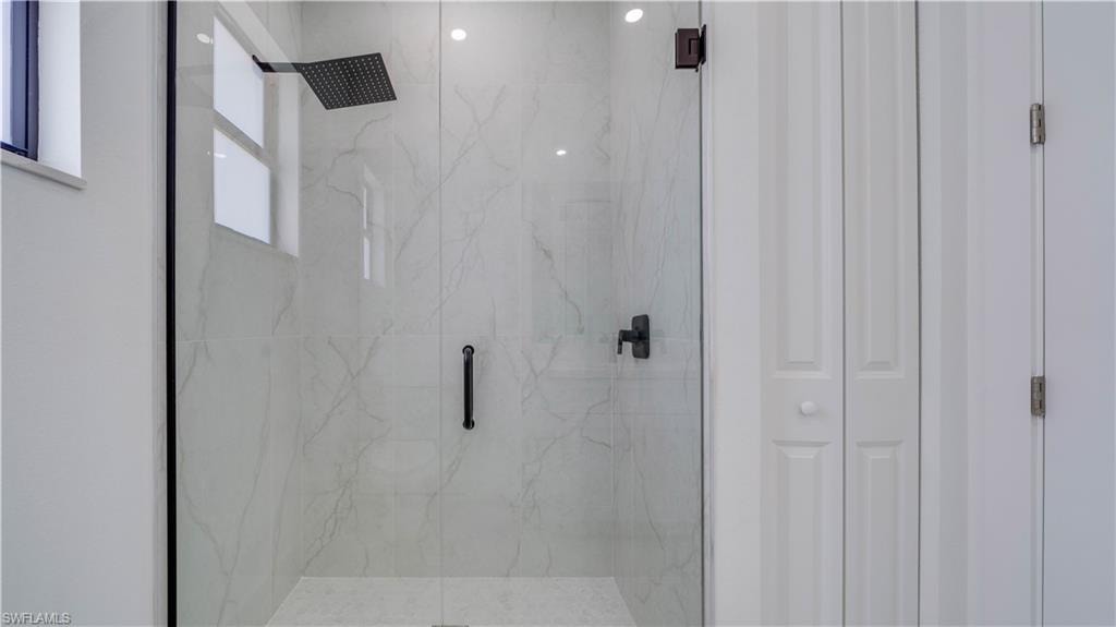 Guest/second bathroom all tile walk-in rain shower.