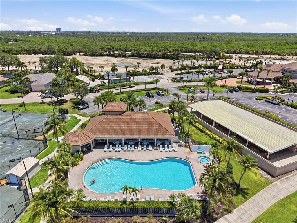 Resort-style pool with integrated spa-  Golf course is currently under renovations. Virtually enhanced photo to show how it could look when completed.