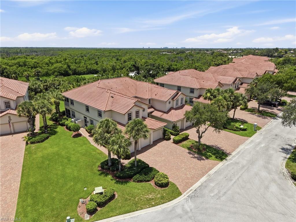 Mediterranean-inspired architecture featuring a terracotta tile roof and stucco exterior