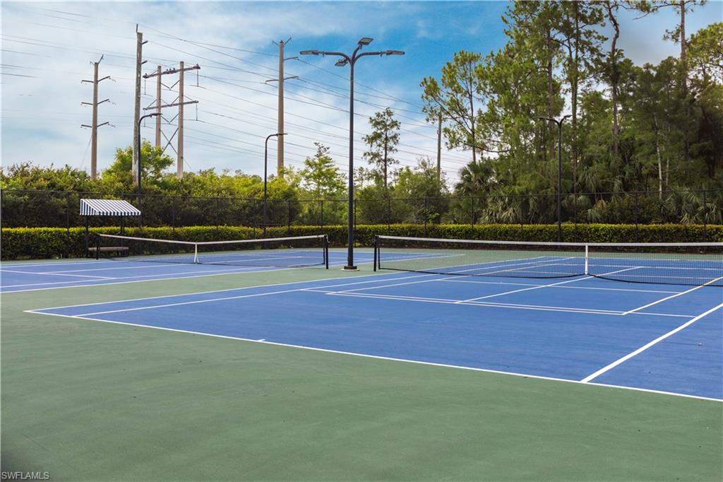 View of tennis court with community basketball court