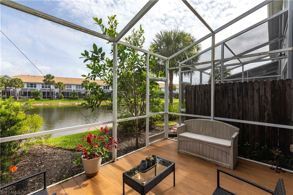 Sunroom / solarium with a water view and an outdoor hangout area