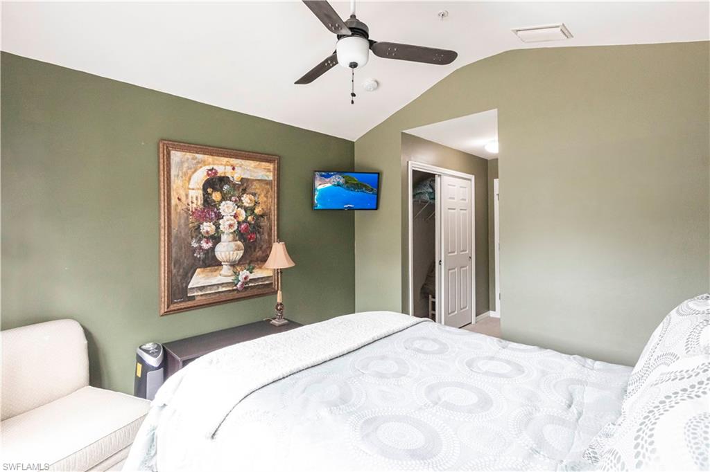 Bedroom featuring vaulted ceiling and ceiling fan