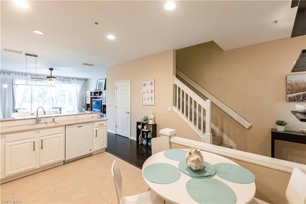 Kitchen with dishwasher, recessed lighting, white cabinets, a ceiling fan, and light countertops