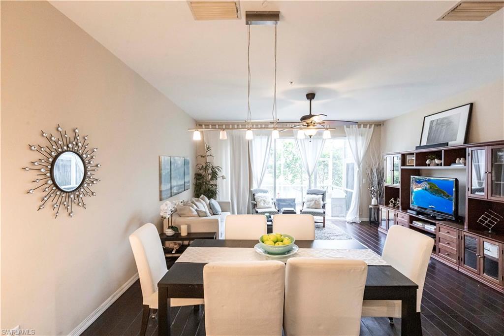 Dining space with dark wood-style floors