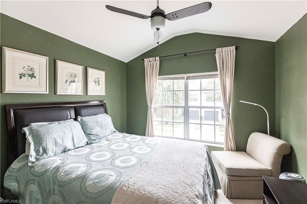 Bedroom featuring lofted ceiling and ceiling fan