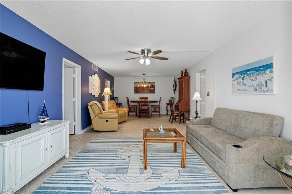 Open-concept living area with tiled flooring throughout