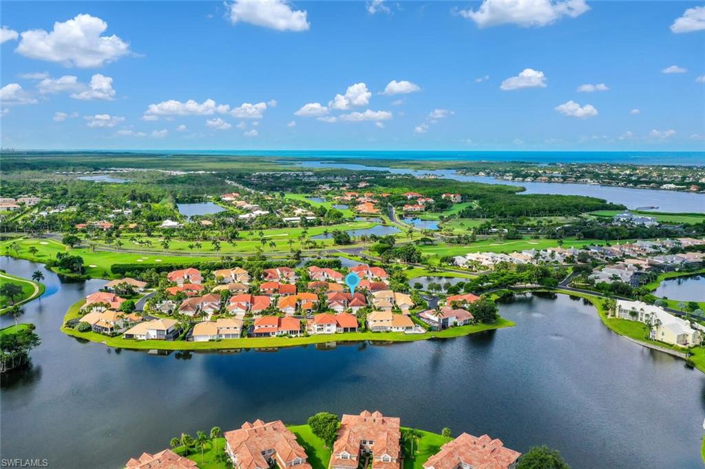 Aerial perspective of suburban area with a large body of water