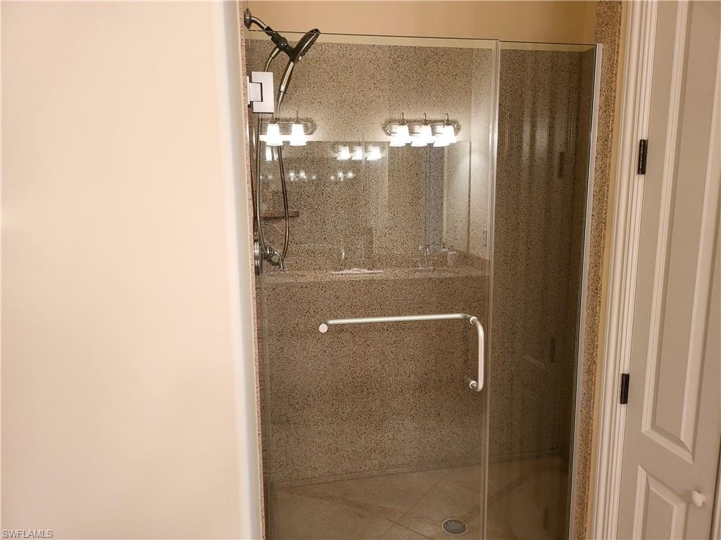 Master bath walk-in shower, granite walls.