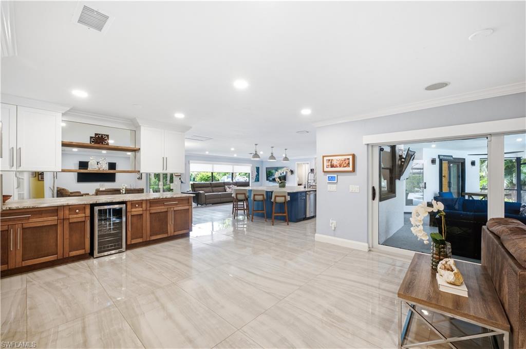 casual tv room off kitchen and pool area