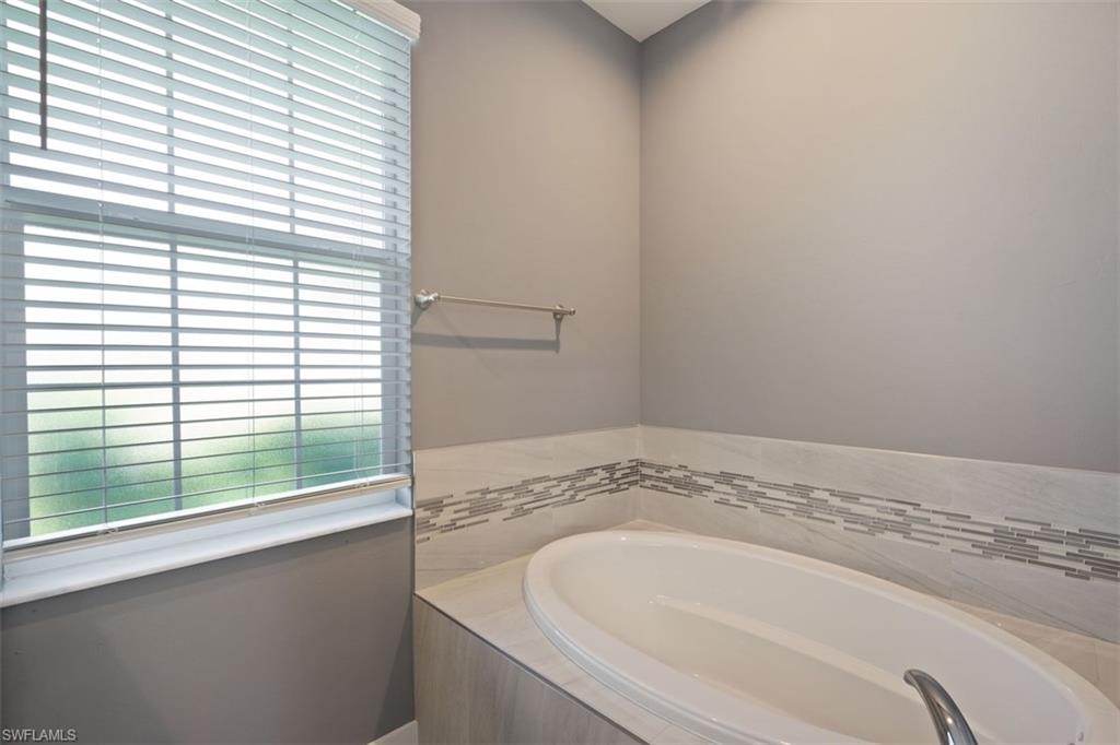 Full bathroom featuring a garden tub