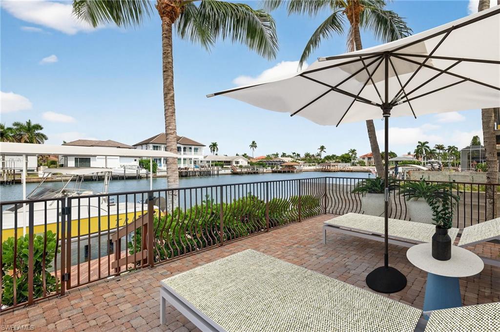 View of patio with a water view and a residential view