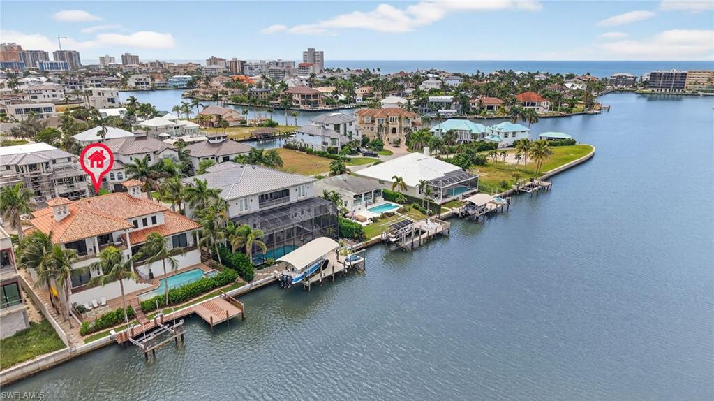 Aerial view of residential area with a nearby body of water