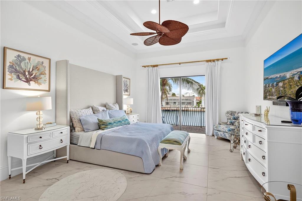 Bedroom featuring access to exterior, light marble finish flooring, ornamental molding, a ceiling fan, and recessed lighting