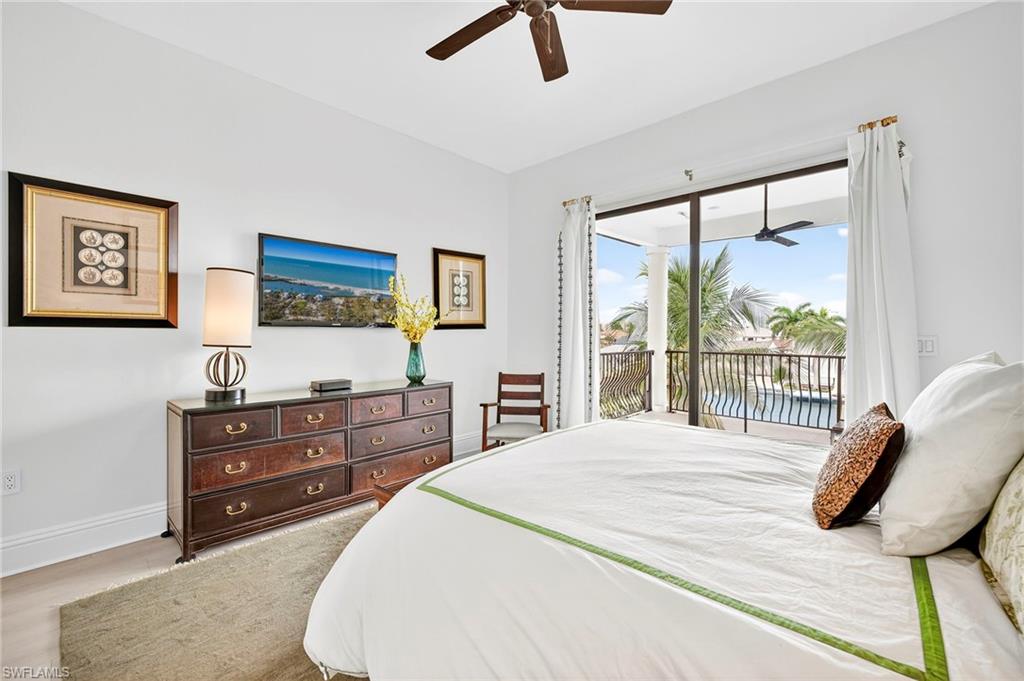Bedroom with a ceiling fan and access to exterior