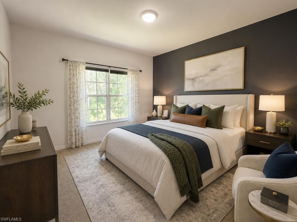 Spacious bedroom featuring a large window, recessed lighting, and a dark accent wall