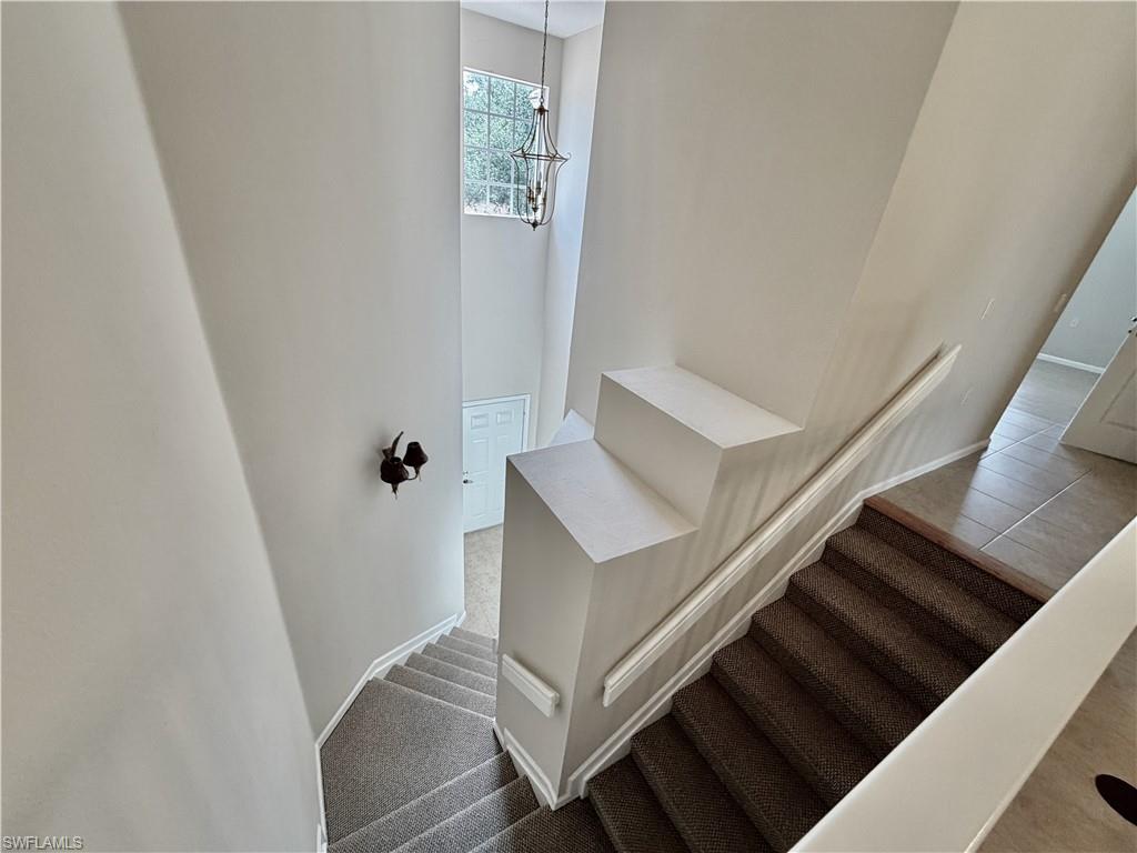 Stairway view to 1st floor garage and entry