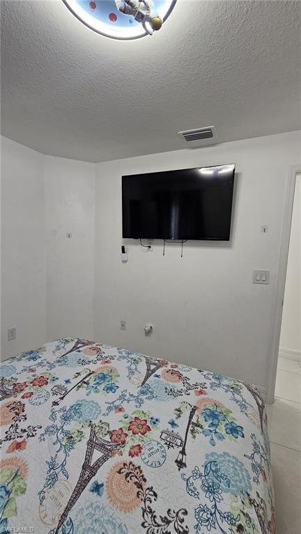 Recessed ceiling light fixture and wall-mounted television