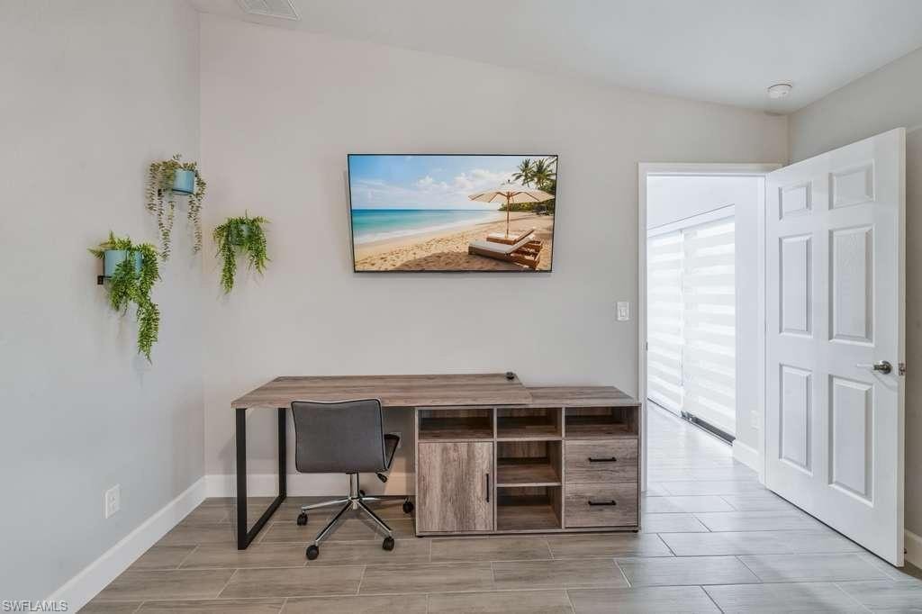 Office with wood tiled floors and baseboards