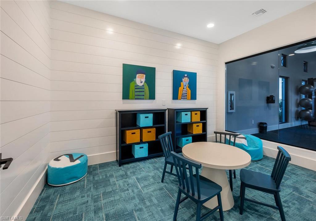 Dining space featuring wooden walls