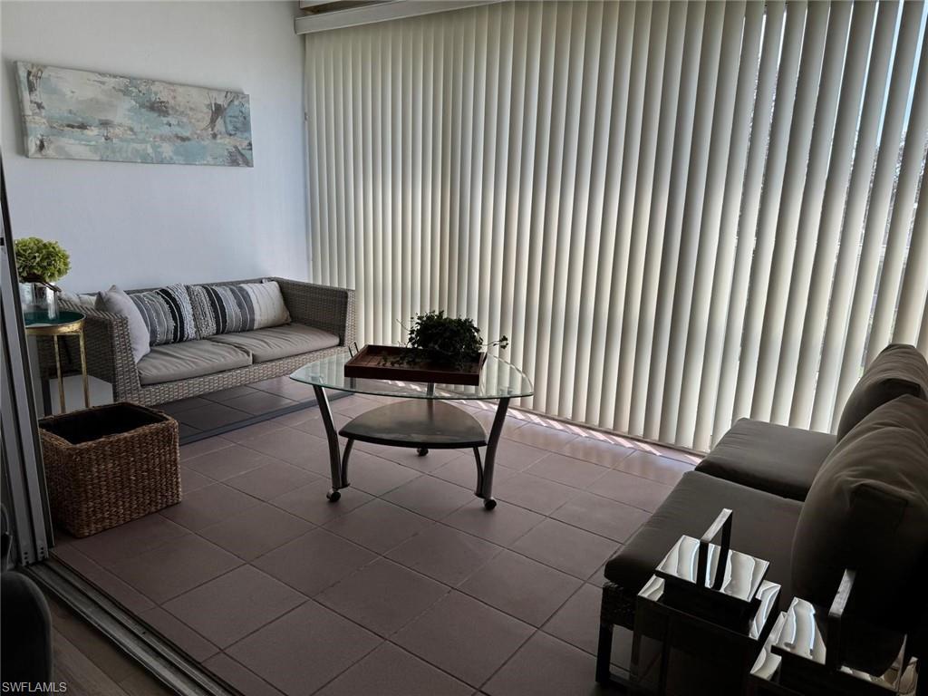 Living room with light tile patterned flooring