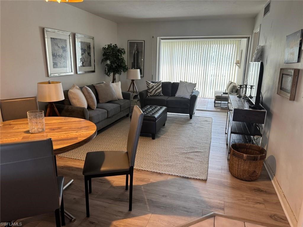 Living room with hardwood / wood-style floors
