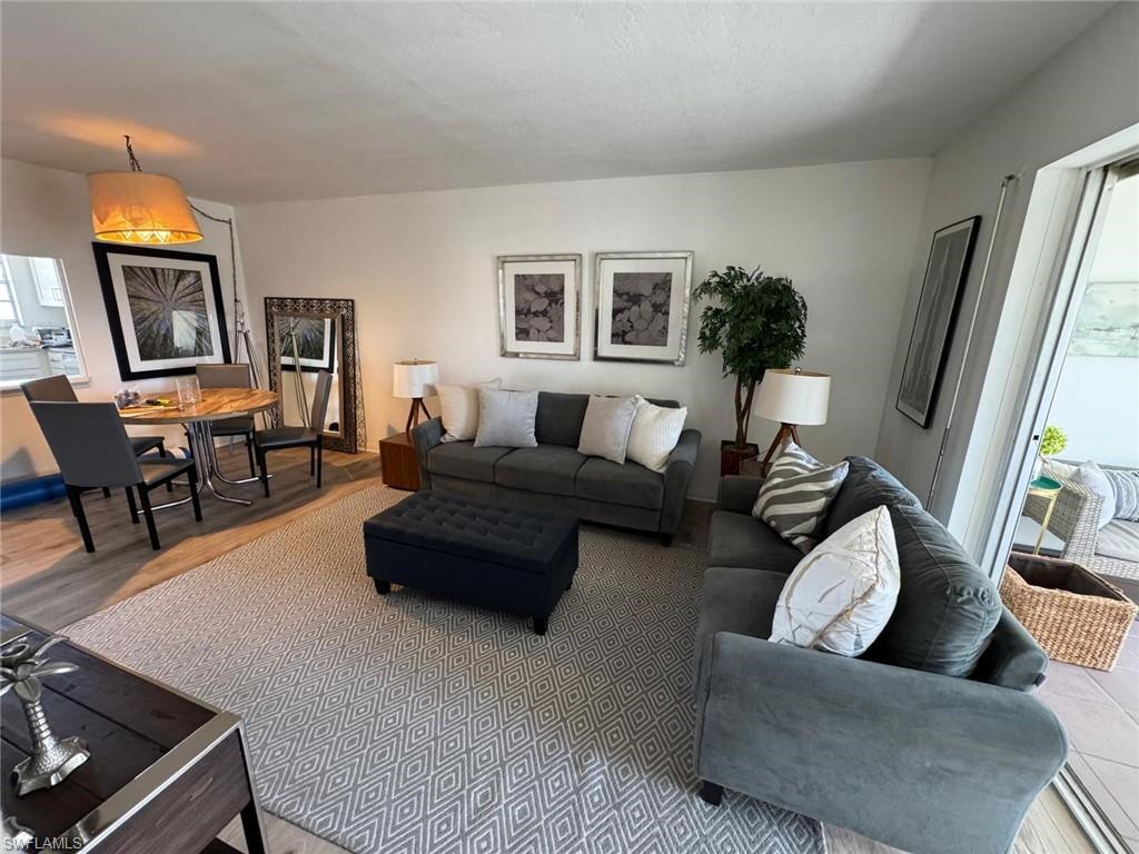 Living room with wood-type flooring