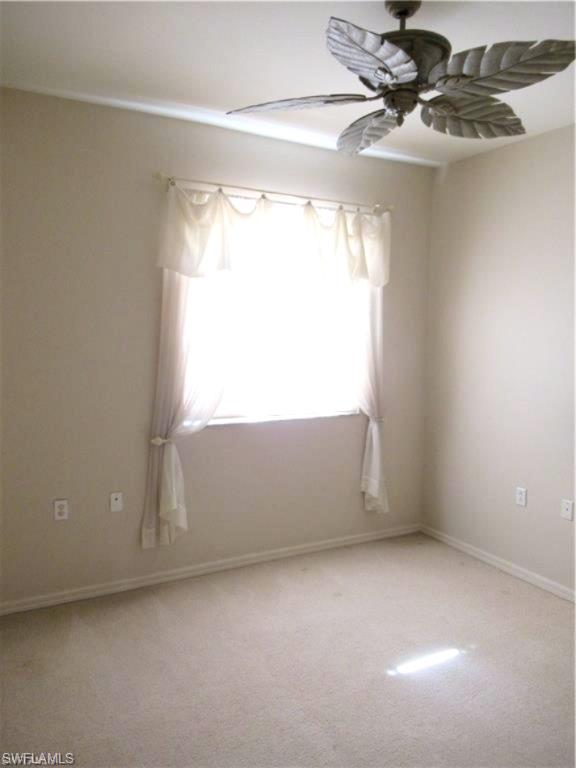 Neutral-toned walls complement light-colored carpeting.