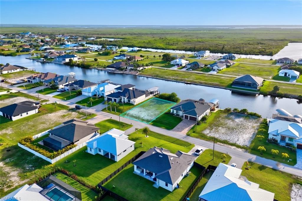 Expansive vacant lot featuring direct water access with canal frontage