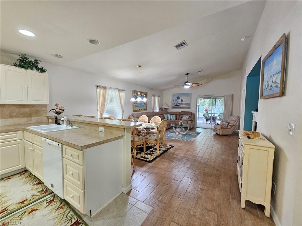 Kitchen bar counter featuring a double-basin sink and integrated dishwasher