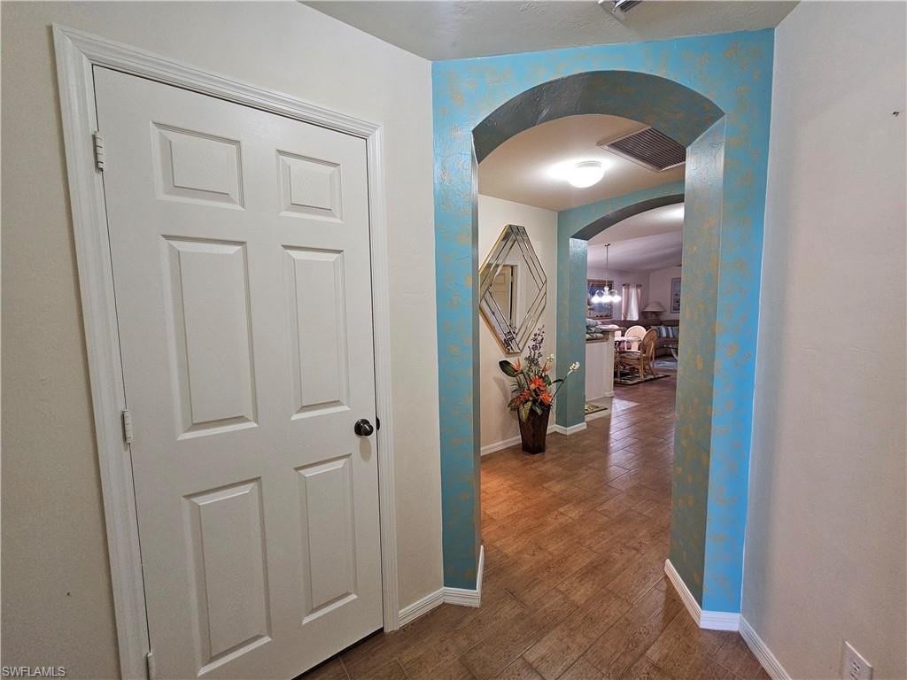 Archways with decorative painting introducing interior spaces