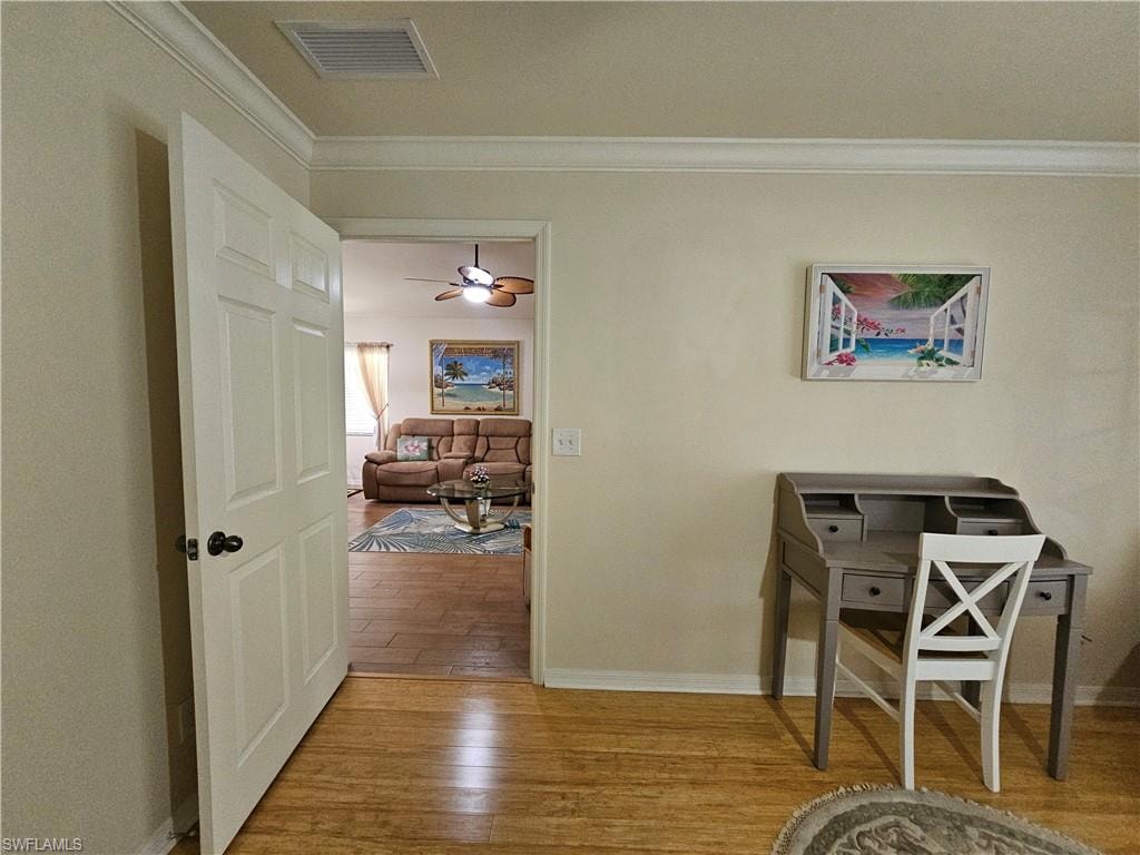 Hardwood flooring extending throughout the room