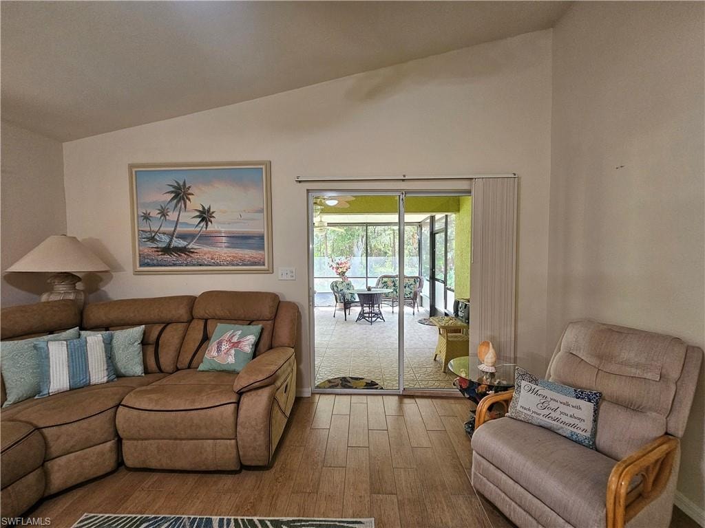 Vaulted ceiling interior with wood-finish flooring