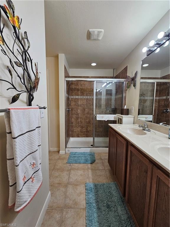 Dual sink vanity with wood-finish cabinetry and light-toned countertop