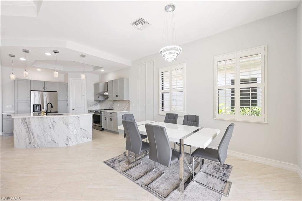 Open-concept living space featuring a modern kitchen and dining area