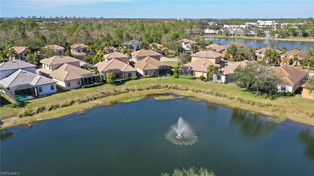 Waterfront community with homes featuring screened patios and mature landscaping