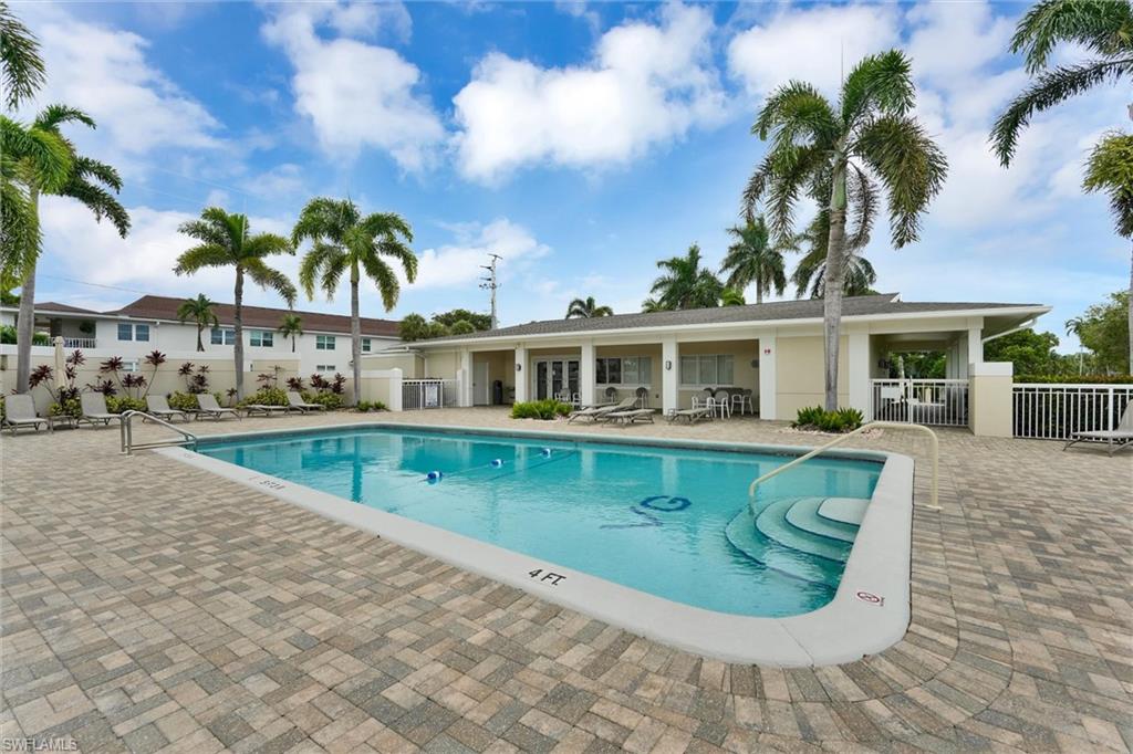 Spacious pool area with indoor showers and restrooms