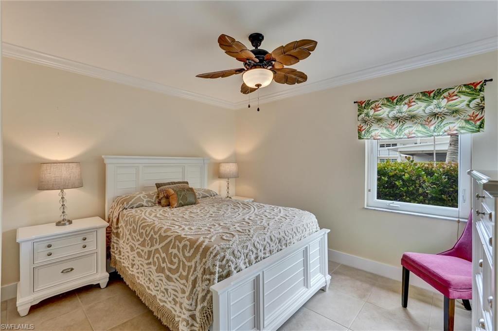 Bedroom number 2 also with 2 storm impact windows, tile floors and ceiling fan