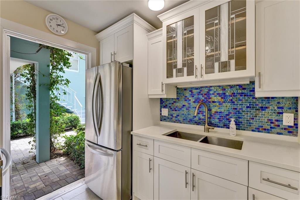Kitchen Door out to courtyard, large 3 door refrigerator/freezer