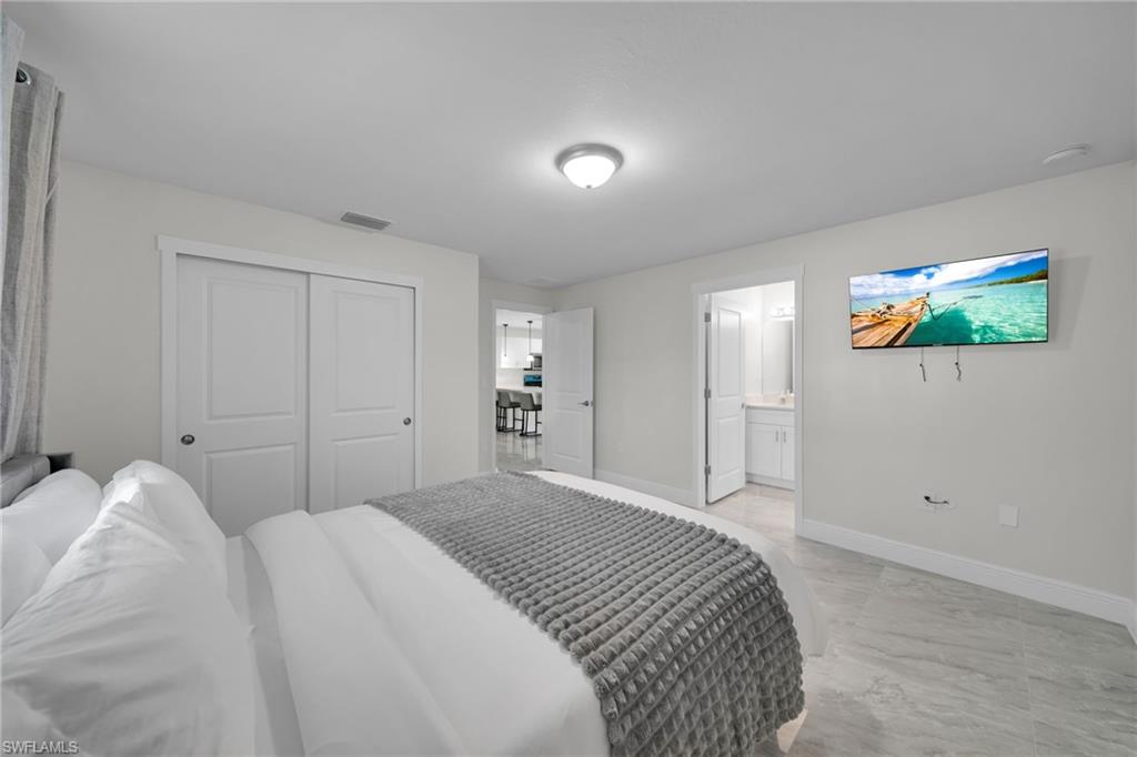 White interior with light grey wall paint and light grey tile flooring