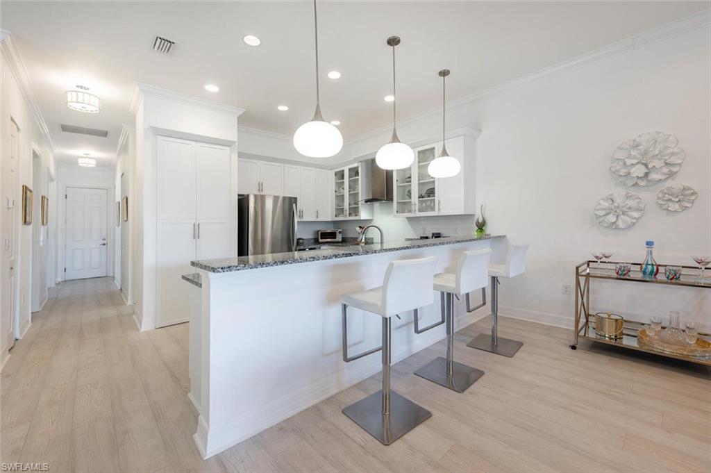 Open concept Kitchen with breakfast bar seating