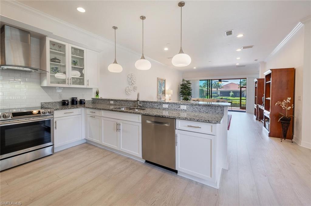 Well designed kitchen with plenty of cabinet and counter space