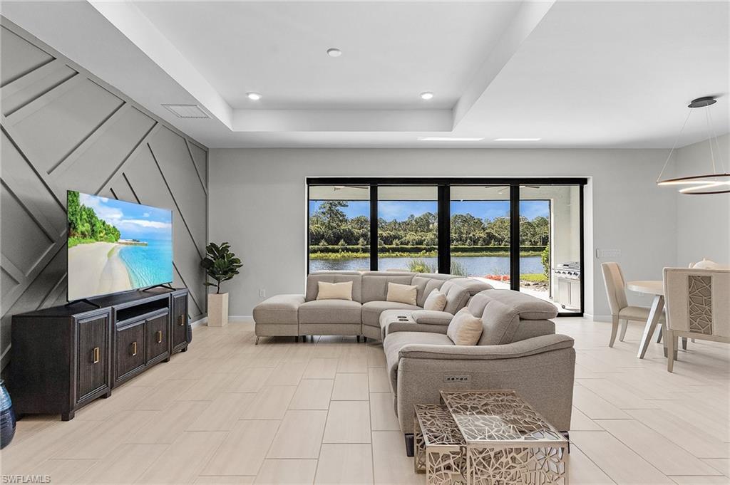 Expansive interior featuring large format tile flooring and a decorative accent wall